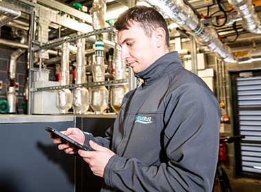Remote-monitoring-ipad Aquatrust employee with a remote water monitoring system