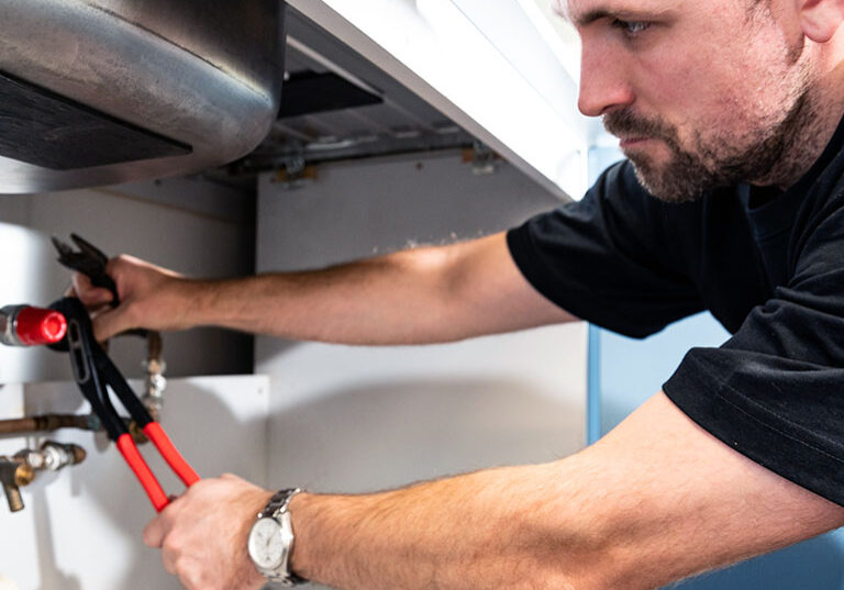 Man carrying out legionella remedial works