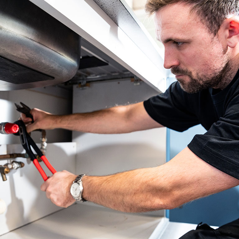 Man carrying out legionella remedial works