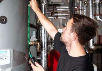 Services-Overview Aquatrust employee using equipment for legionella remedial works